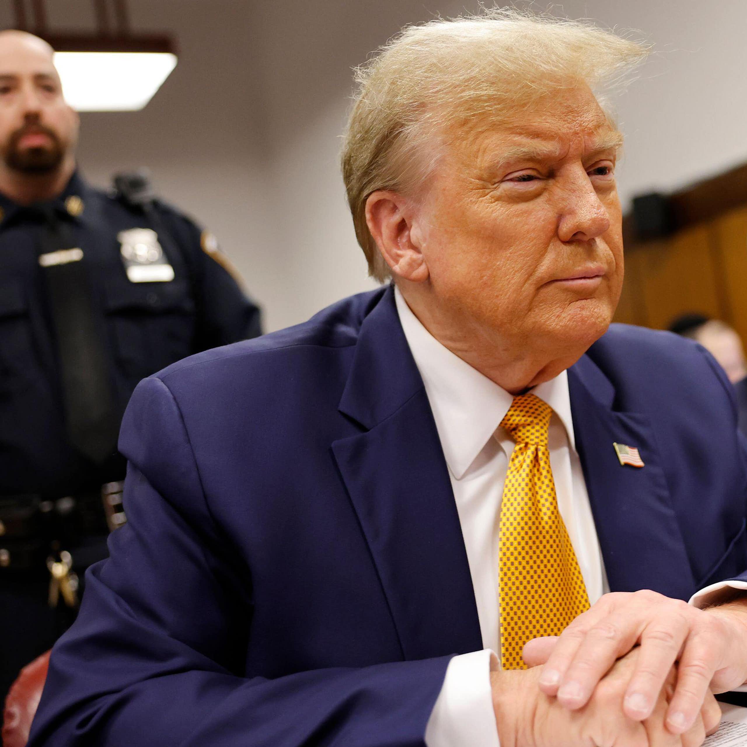 Donald Trump wearing a blue jacket during his trial in May 2024.