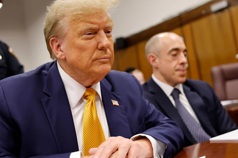 Donald Trump wearing a blue jacket during his trial in May 2024.