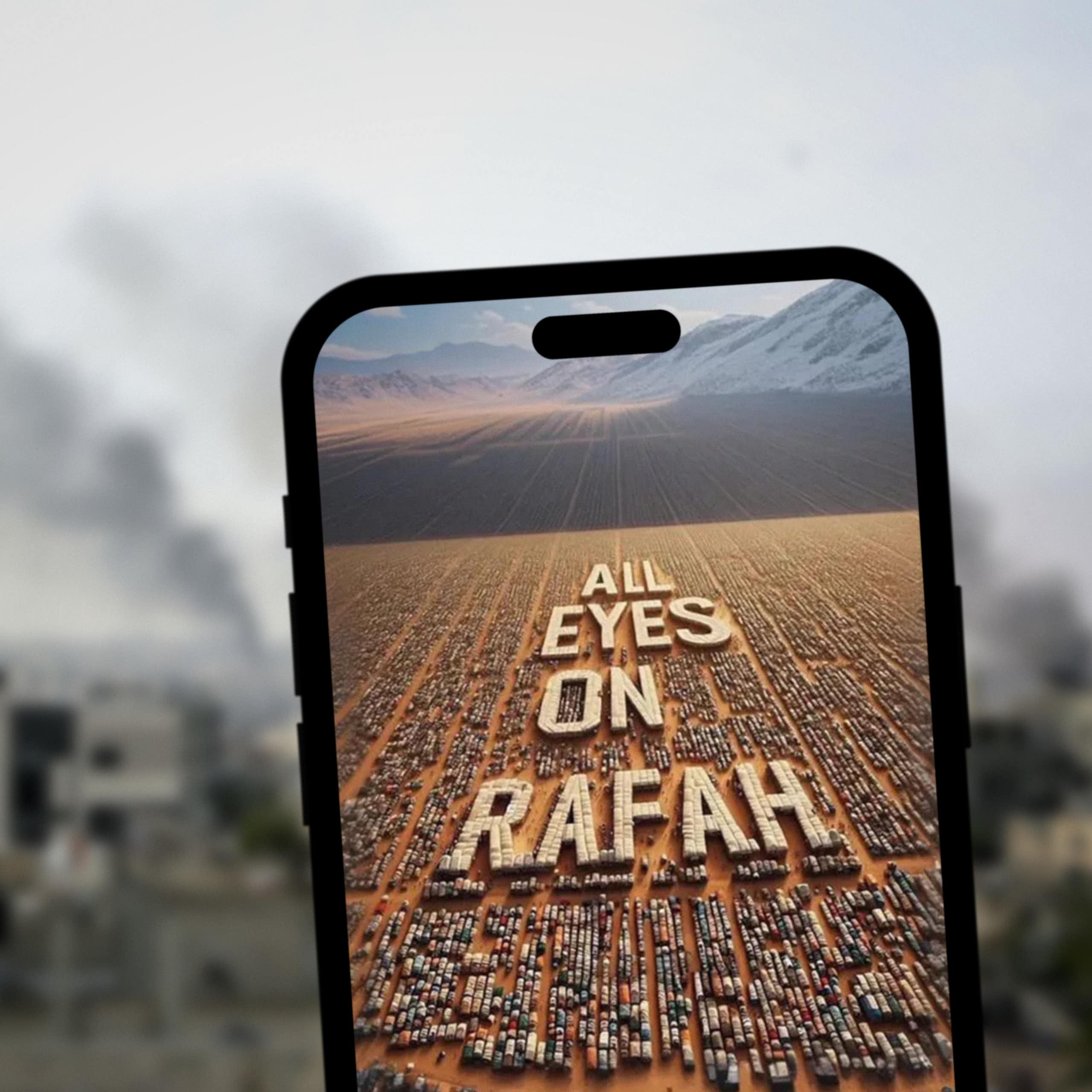 All Eyes On Rafah Instagram story displayed on smartphone screen, while Rafah, Palestine is blurred in the background.