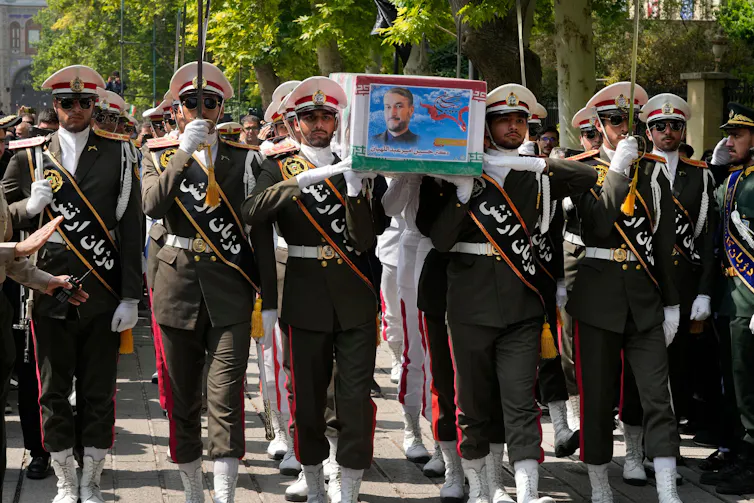 Army members carry the coffin of Iranian foreign minister Hossein Amirabdollahian, who was killed in a helicopter crash along with President Ebrahim Raisi in Tehran, Iran, on May 23 2024.