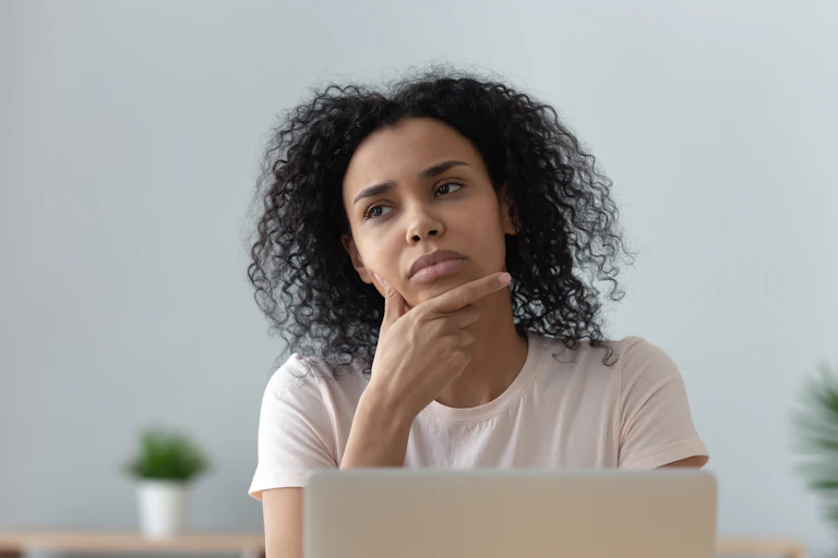 A young woman looking pensive
