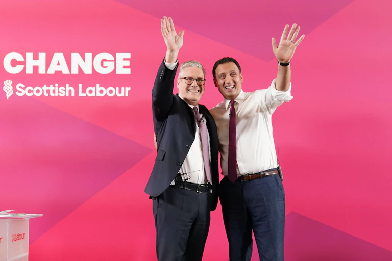 Keir Starmer and Anas Sarwar waving