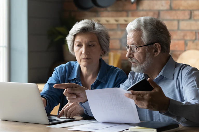 Couple looking at a laptop