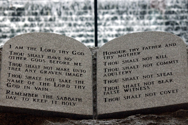 Two stone slabs with rounded tops inscribed in formal font.