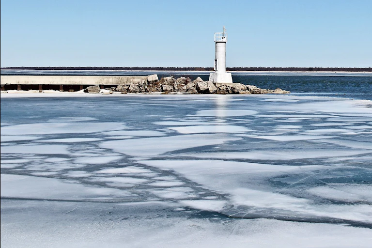 Thin ice near a lighthouse.
