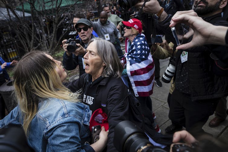 Pro-Trump protesters arguing with counter-protesters.
