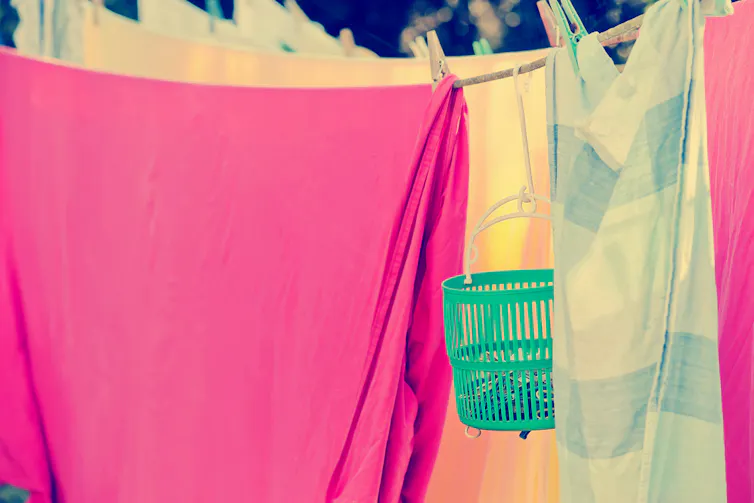 Colourful sheets on washing line