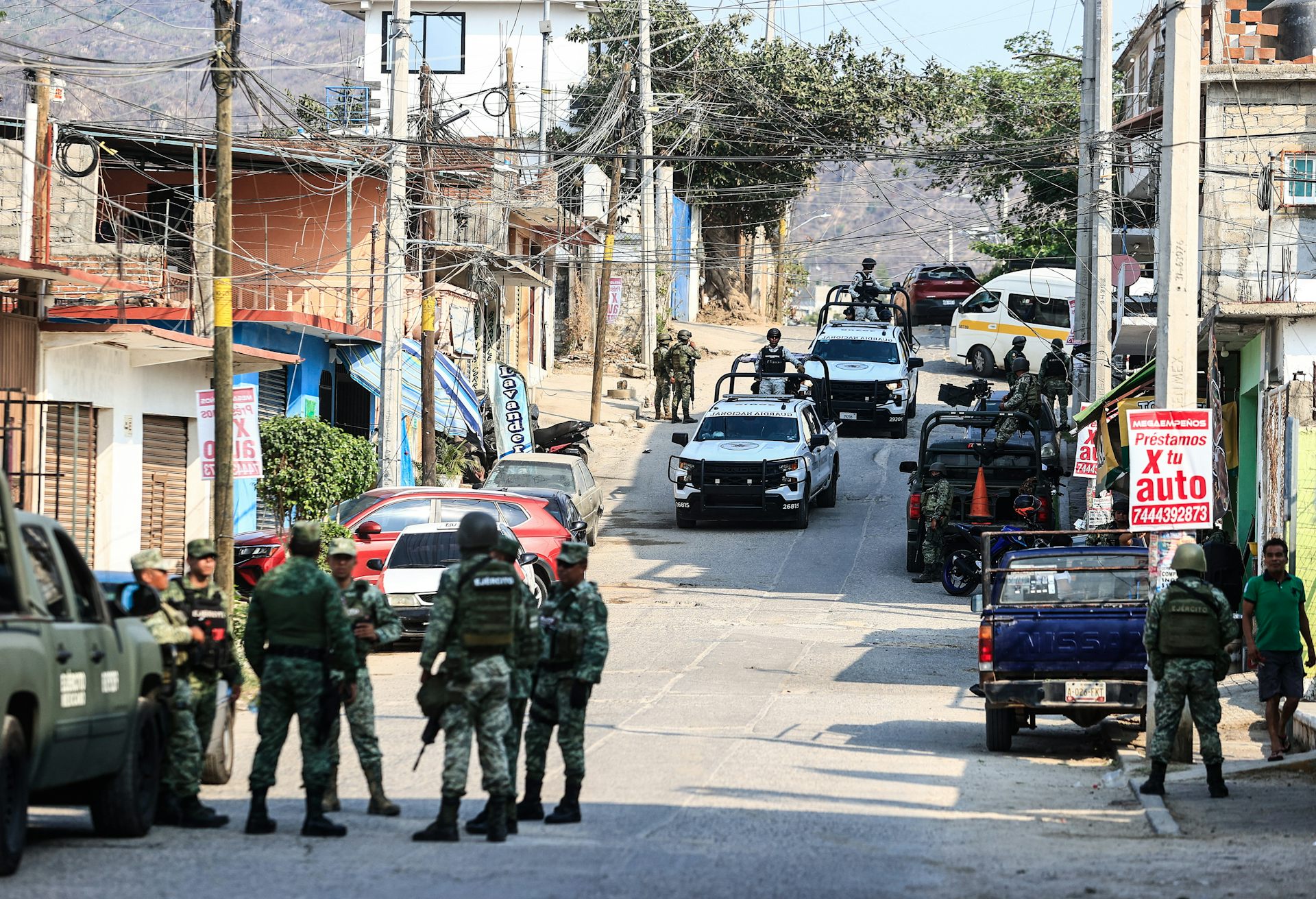National Guard and army personnel guard an area where four bodies were found in Acapulco.
