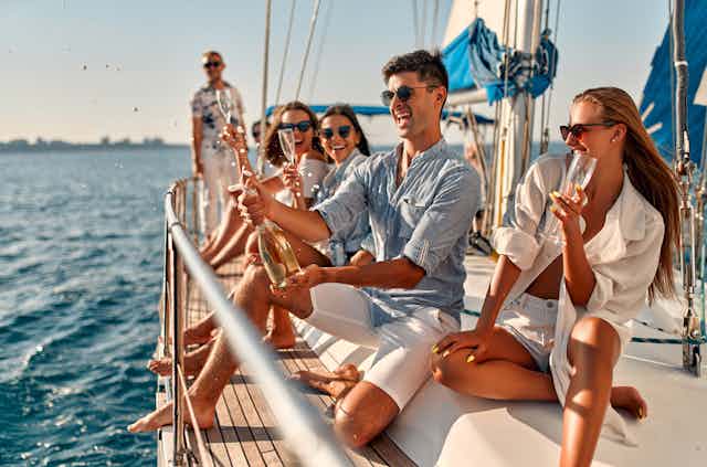 A group of white, young friends on a yacht.