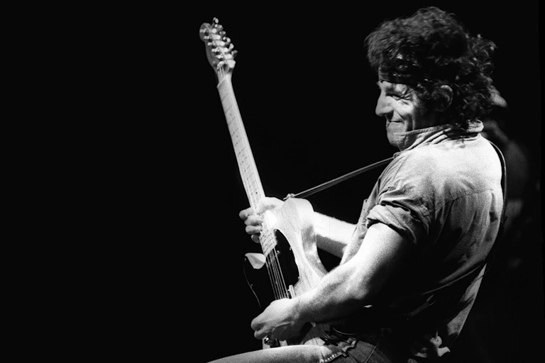 Man playing a guitar.