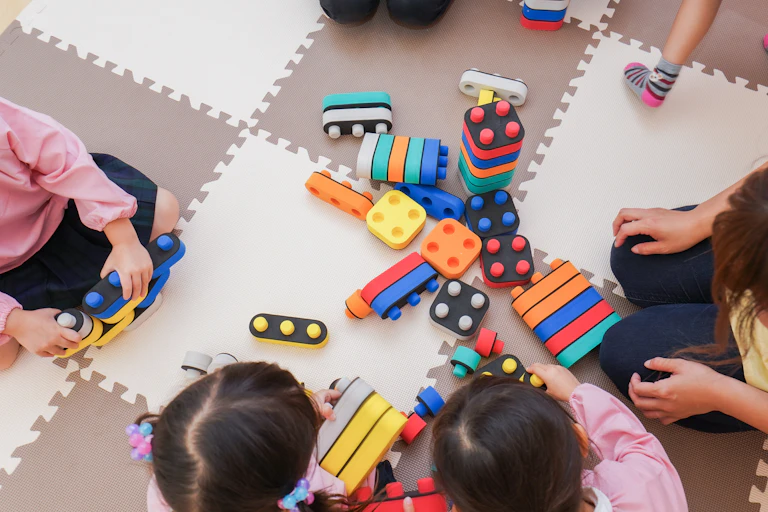Children playing with stackable blocks.