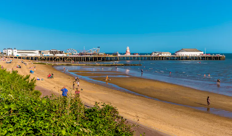 Clacton pier and beach on a sunny day.
