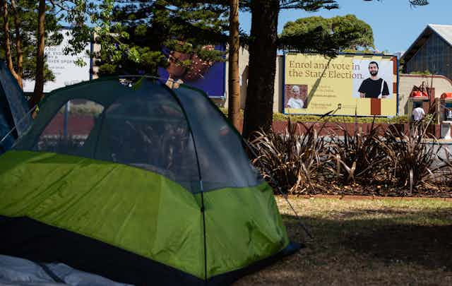 A tent is pitched in a public park