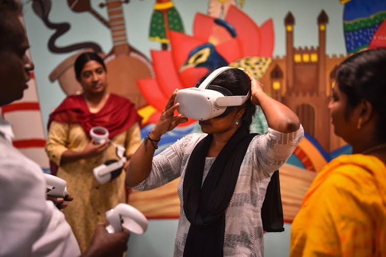 A young woman wearing a virtual reality headset.