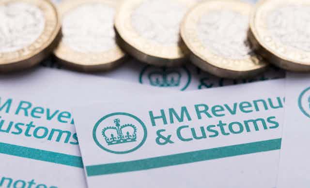 pound coins and HMRC headed notepaper
