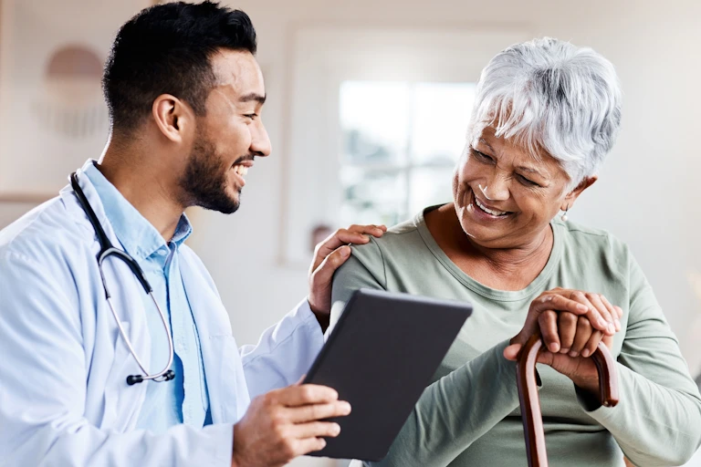 A doctor and a woman holding a cane