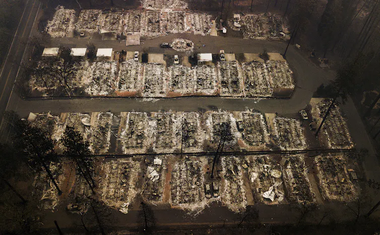 Aerial view of rows of houses burnt to the ground by a wildfire