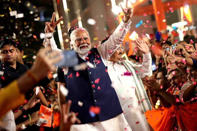 Narendra Modri celebrates with supporters.