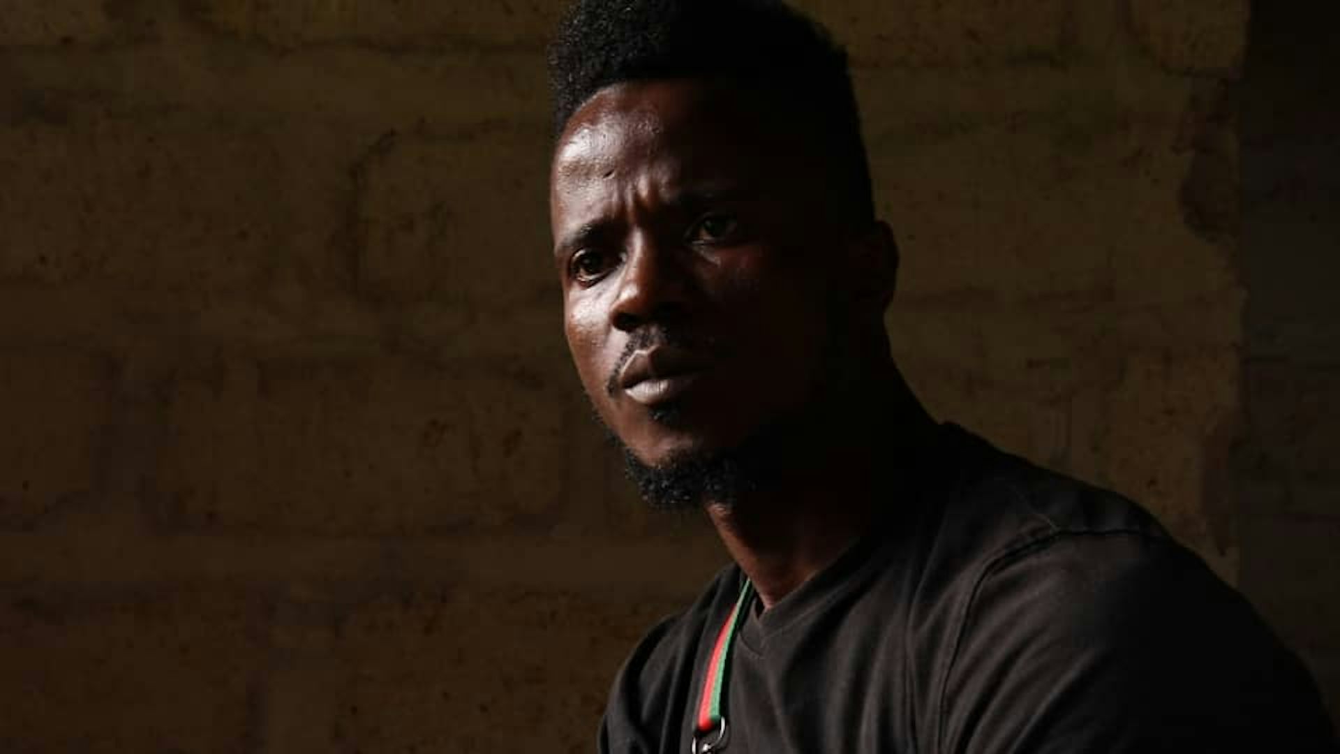 Gaz in the dark, looking off-camera