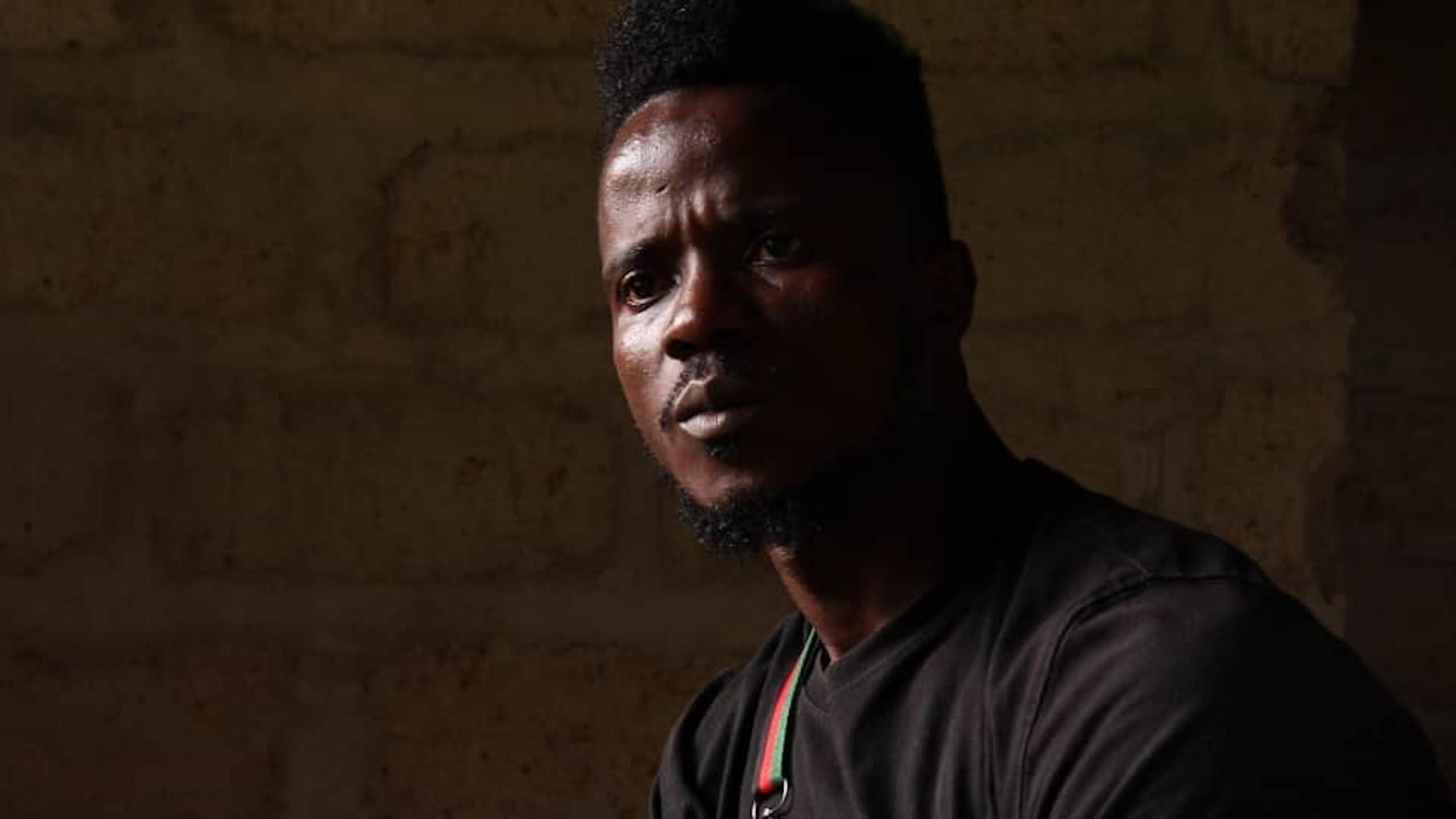 Gaz in the dark, looking off-camera