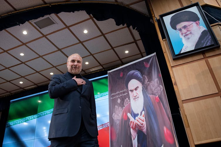 Iranian parliamentary speaker and presidential candidate Mohammad Bagher Ghalibaf waves for the press after registering for the eleciton.