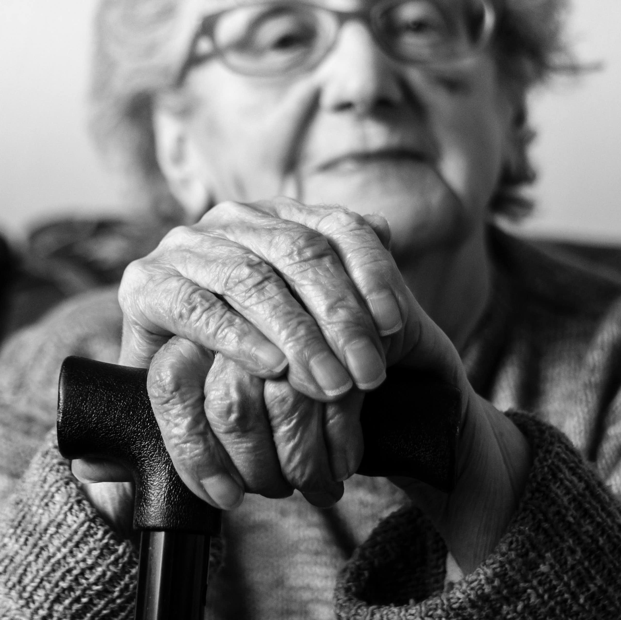 A black and white photograph of an elderly lady.