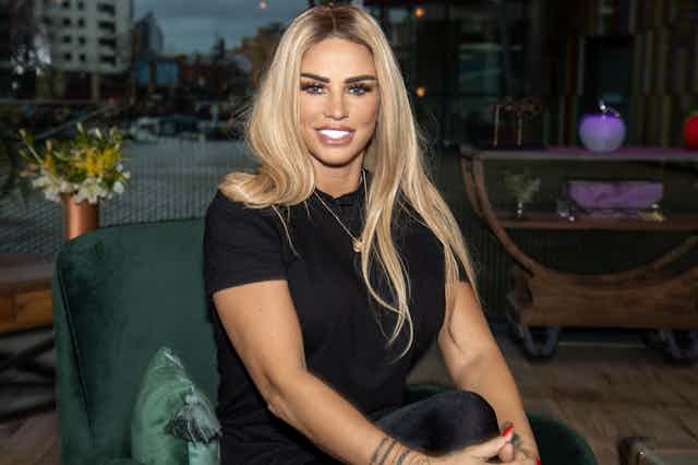 Katie Price smiles at camera with bright white teeth