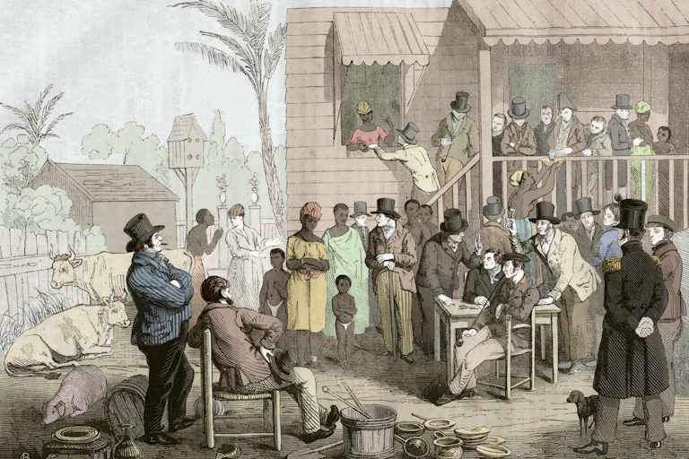 A colorized engraving depicting the sale of slaves in the United States during the 19th century.