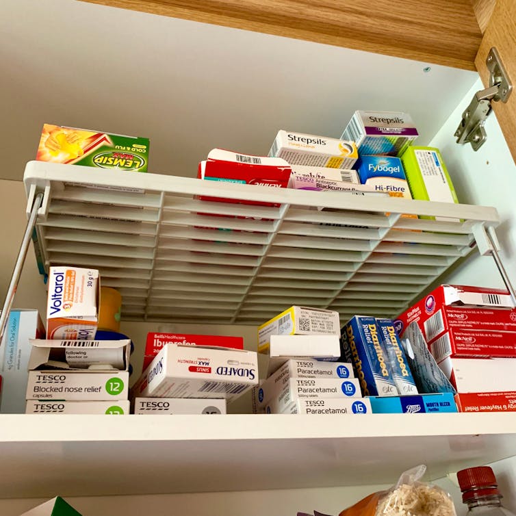 Kitchen cupboard full of stockpiled medicine