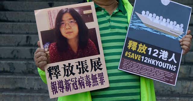 Posters highlighting Zhang Zhan's imprisonment.