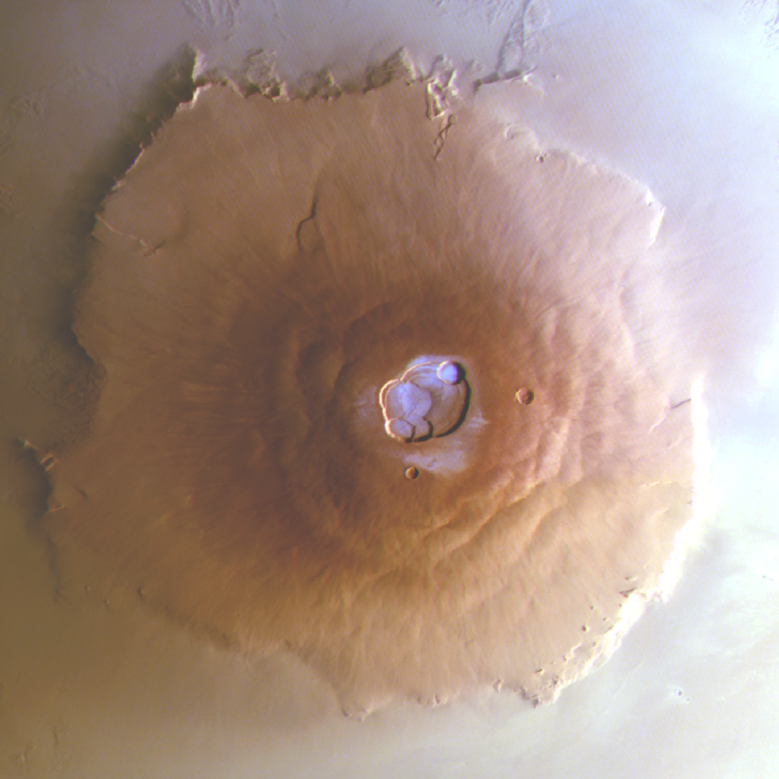 The summit of Olympus Mons on Mars, with frozen water visible in the crater.