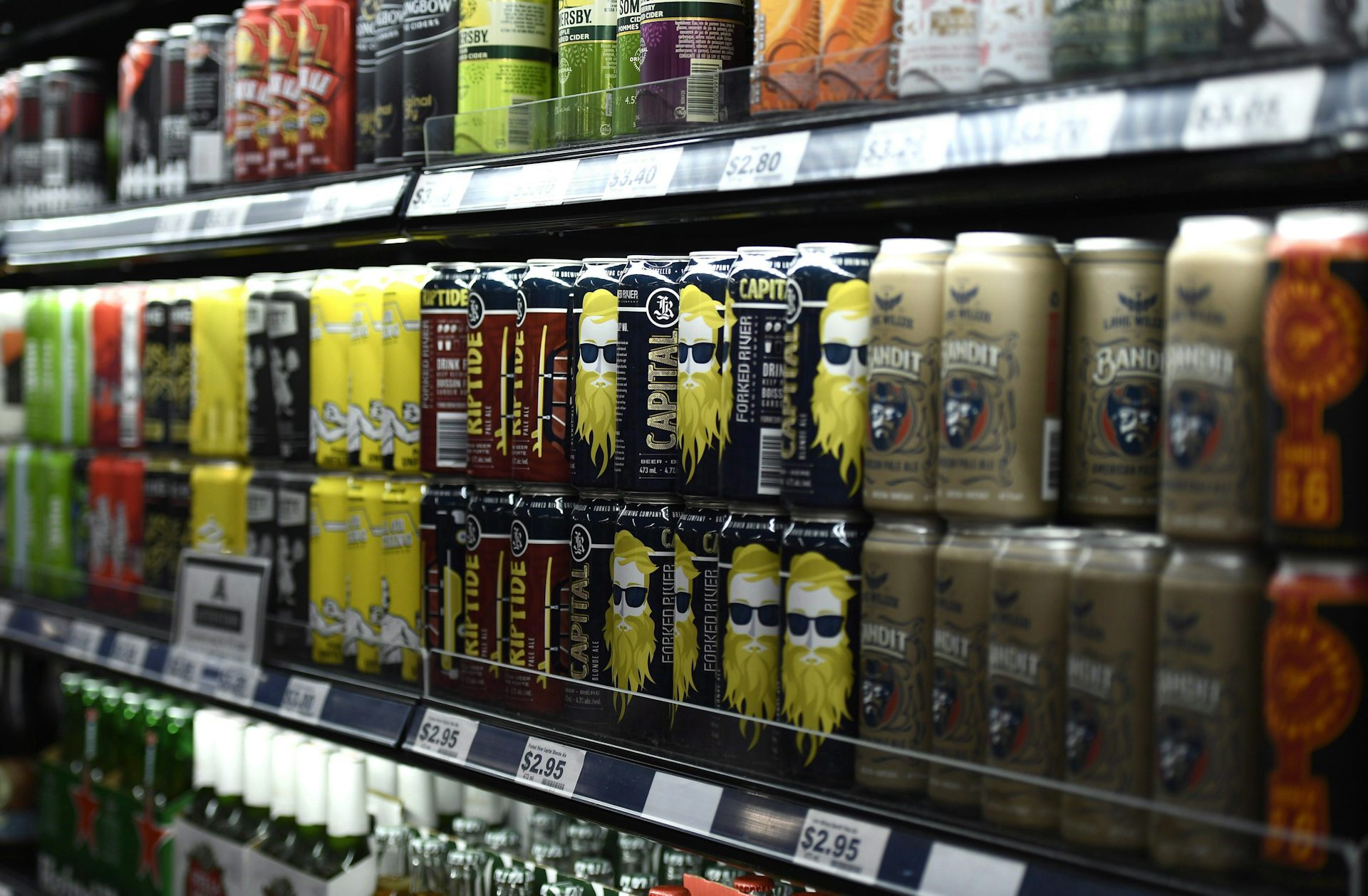 A shelf of beer and other canned alcoholic beverages