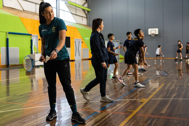 Triple Olympic snowboarder Belle Brockhoff plays badminton with students
