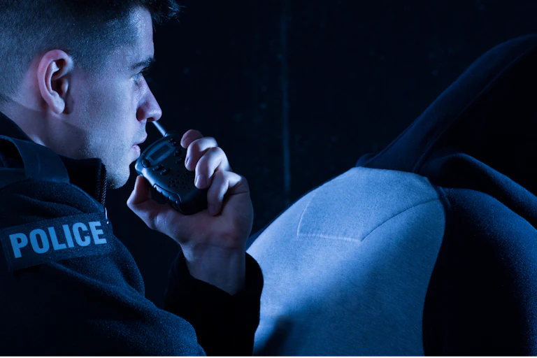 Police with another person in a hoodie