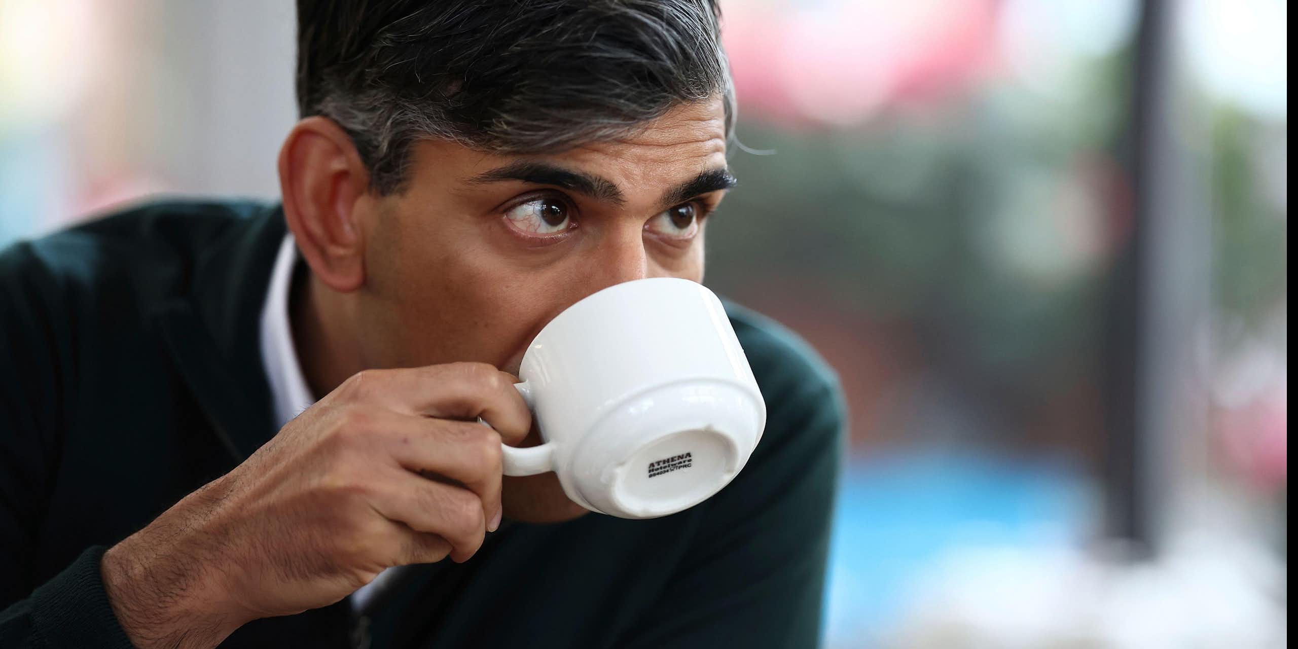 Rishi Sunak drinking from a teacup.