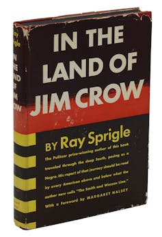 Black, white and yellow book cover with the bold text reading 'In the Land of Jim Crow.'