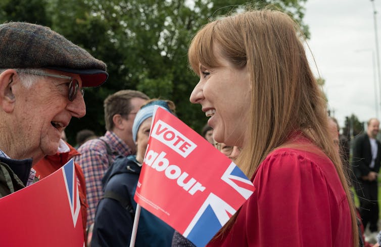 Angela Rayner talking to an elderly man.