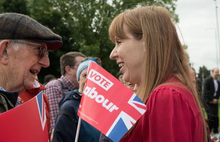 Angela Rayner talking to an elderly man.