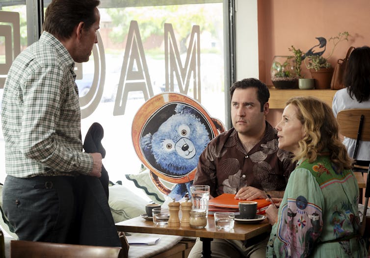 Julian, Ingrid and Austin at a cafe.