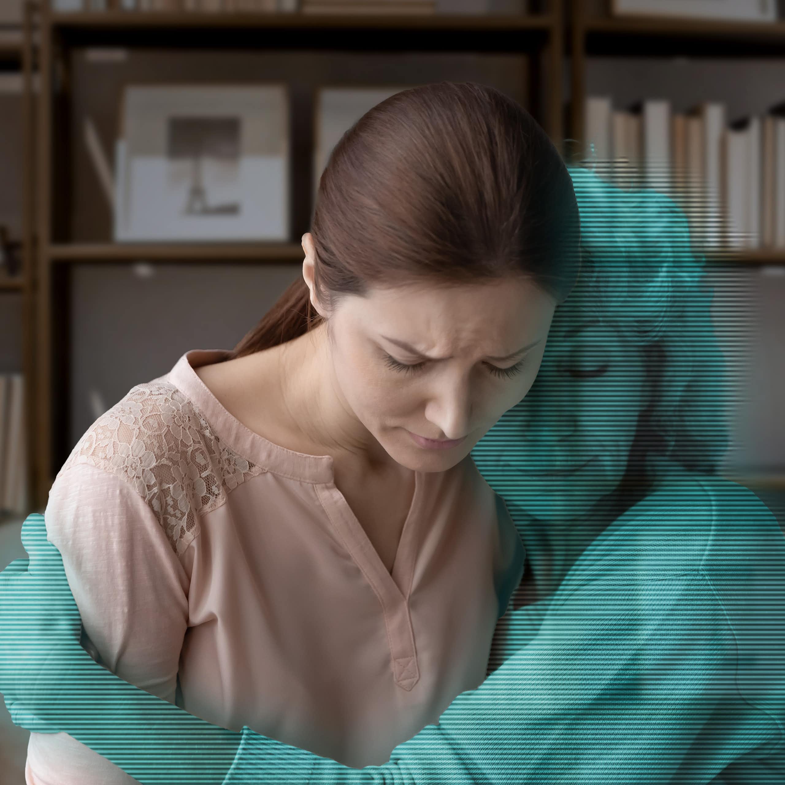 Art concept: a grieving woman is hugged by a blue digital avatar of her mother.