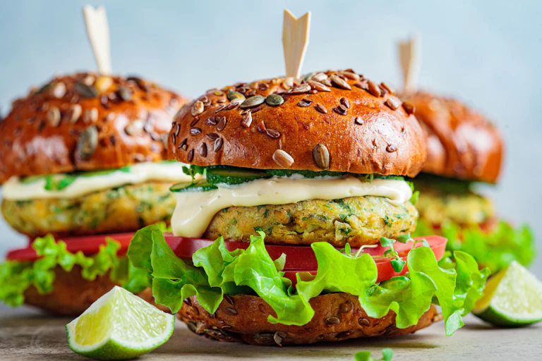 Veggie burgers with quarters of lime
