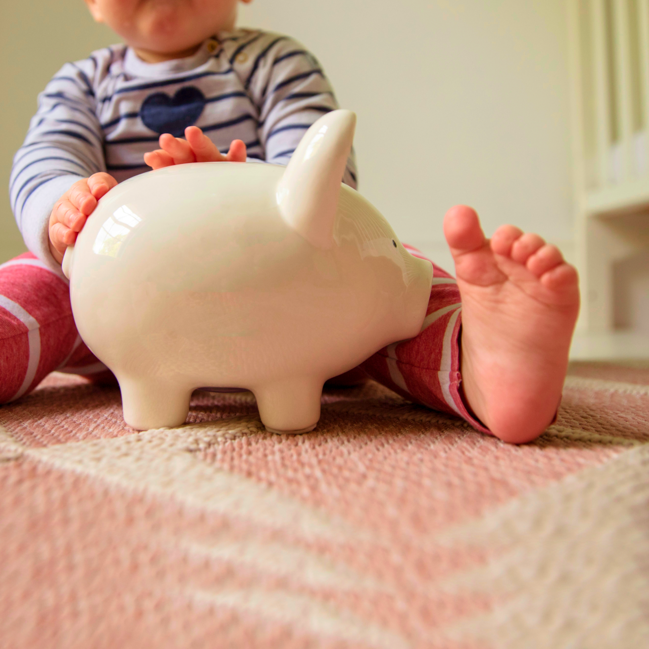 Baby with piggy bank
