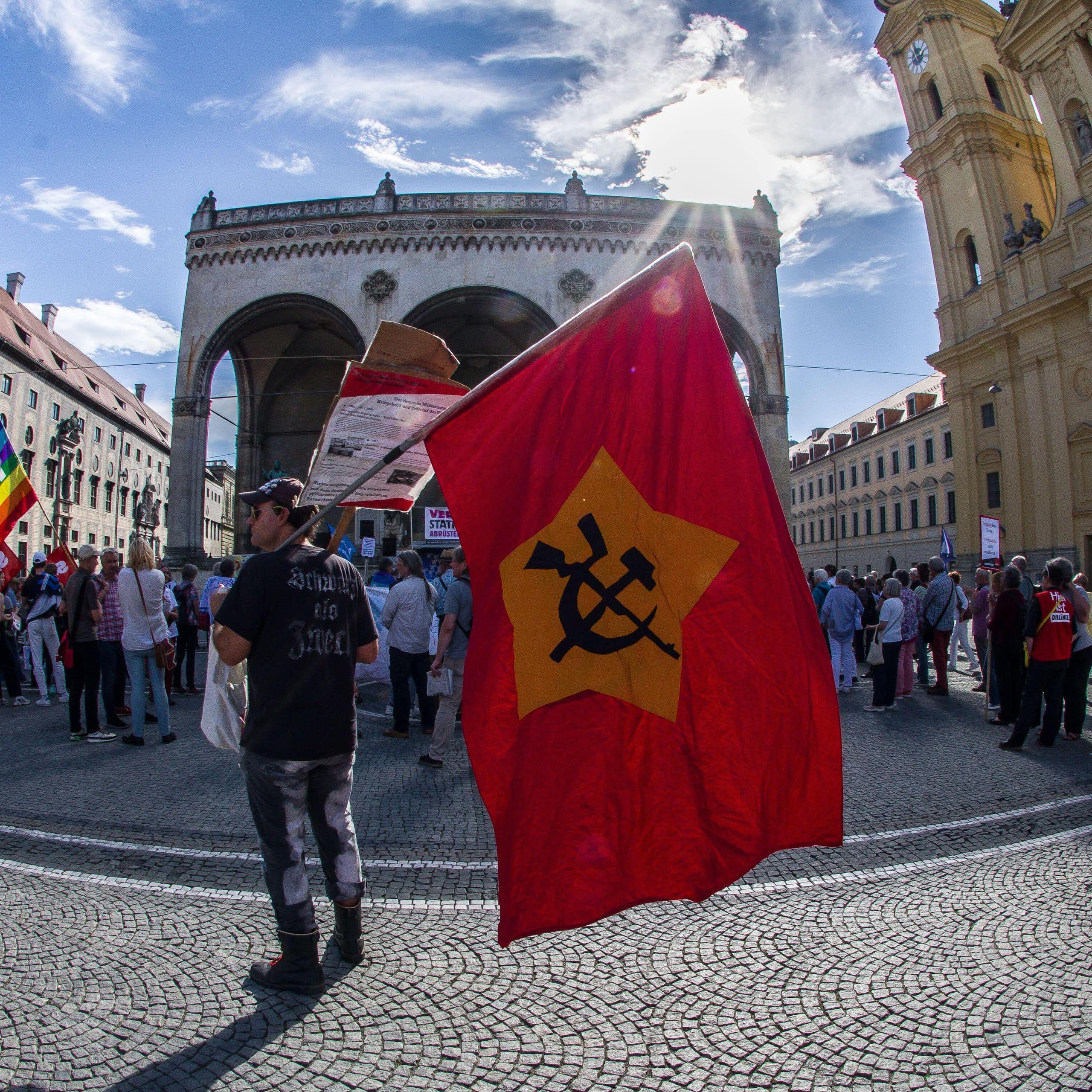 A pro-Russia supporter with a Soviet flag, demonstrates in Germany.