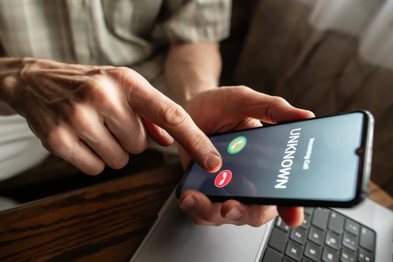 https://www.gettyimages.com/detail/photo/senior-man-refuses-to-answer-to-a-call-from-unknown-royalty-free-image/1798627099