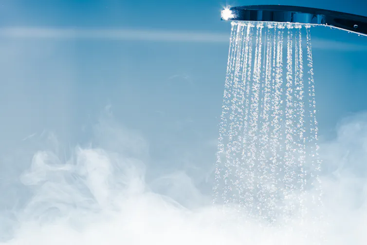 An image of a running shower head.