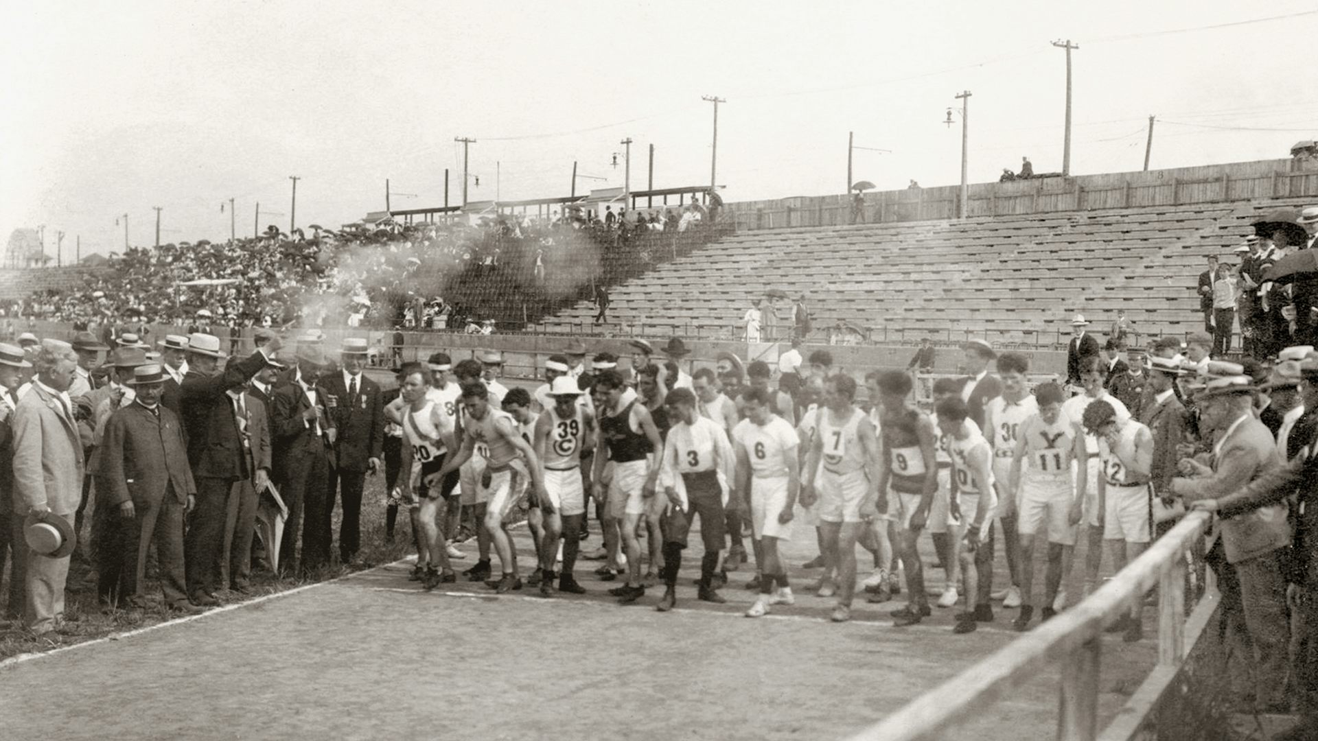 Start of the Marathon Race, 1904 Olympics. A: Runners prepare for start. B. David R. Francis fires starting gun.