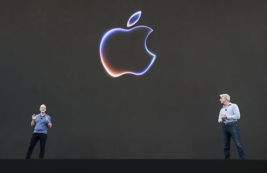 Apple CEO Tim Cook and software engineering head Craig Federighi unveiling new AI features at the Apple Worldwide Developers Conference. 