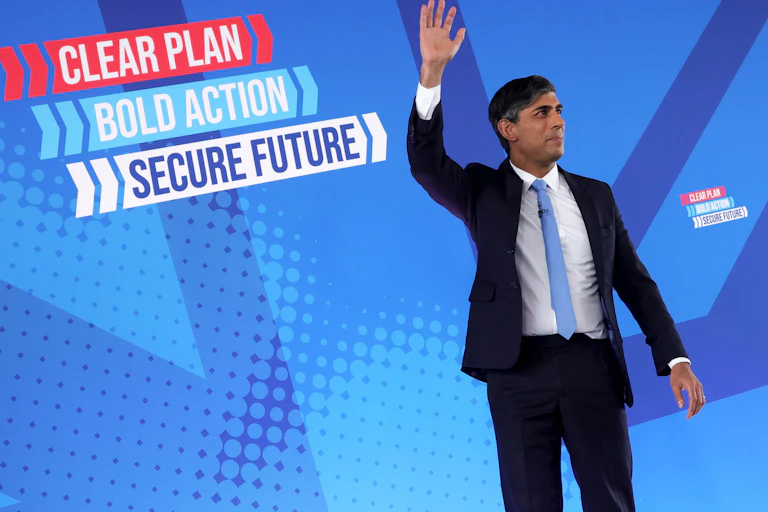 Rishi Sunak waving