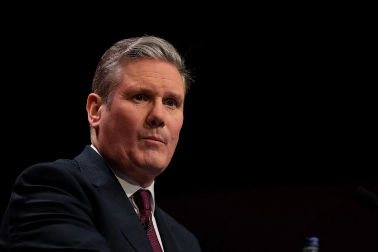 Keir Starmer in a black suit.