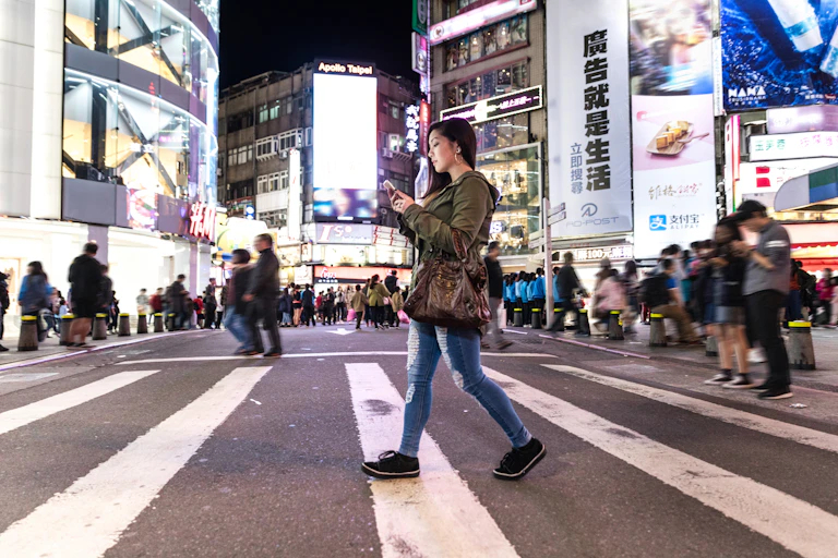 Asian woman at night in downtown Taipei in Taiwan.